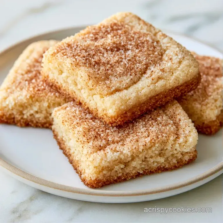 A neat stack of soft, pale gold dessert squares on a white ceramic plate garnished with a fresh red strawberry.